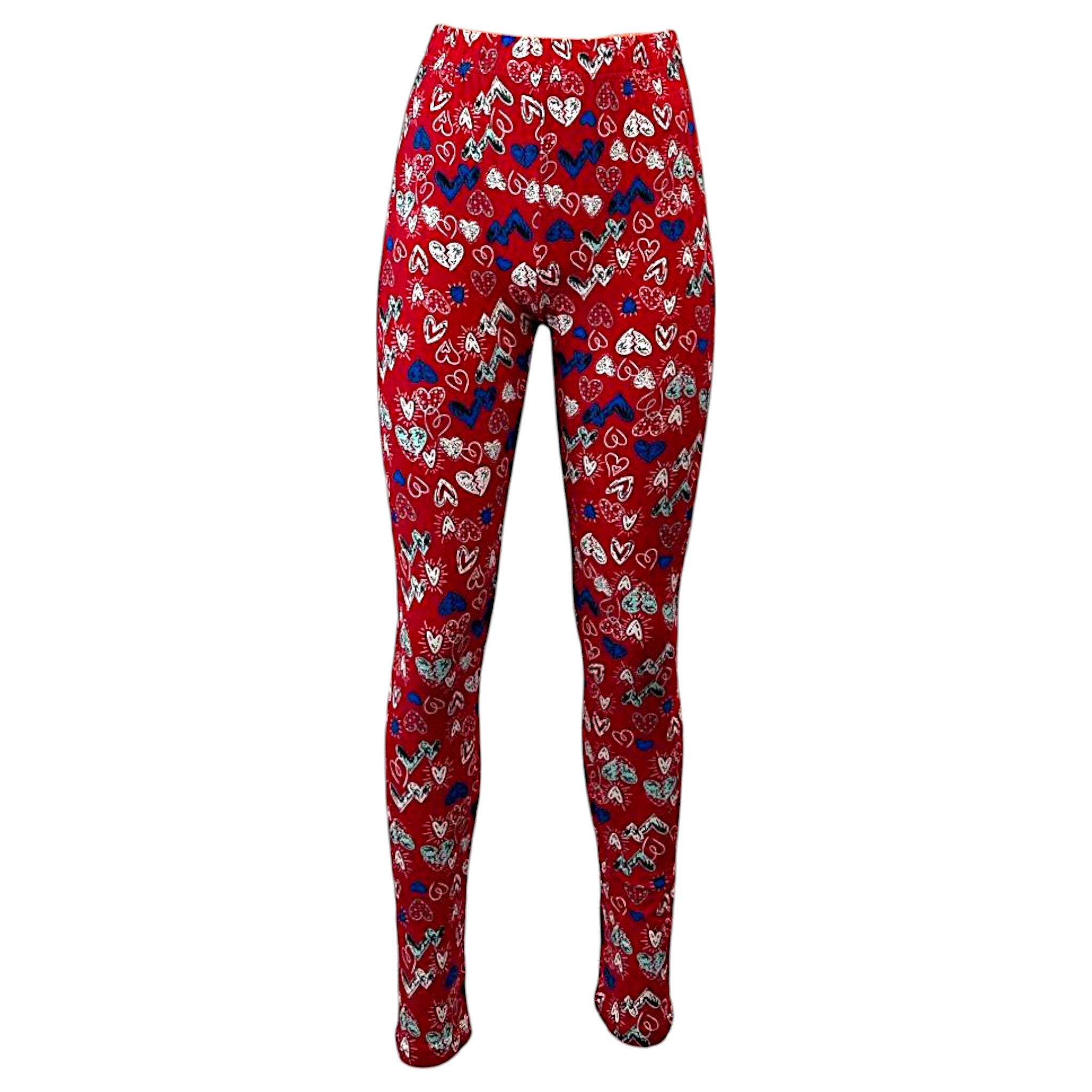 Women's full-length leggings in red with a playful multi-colored heart pattern, including blue, white, and black hearts. Designed with an elastic waistband and stretchy fabric for a comfortable fit.